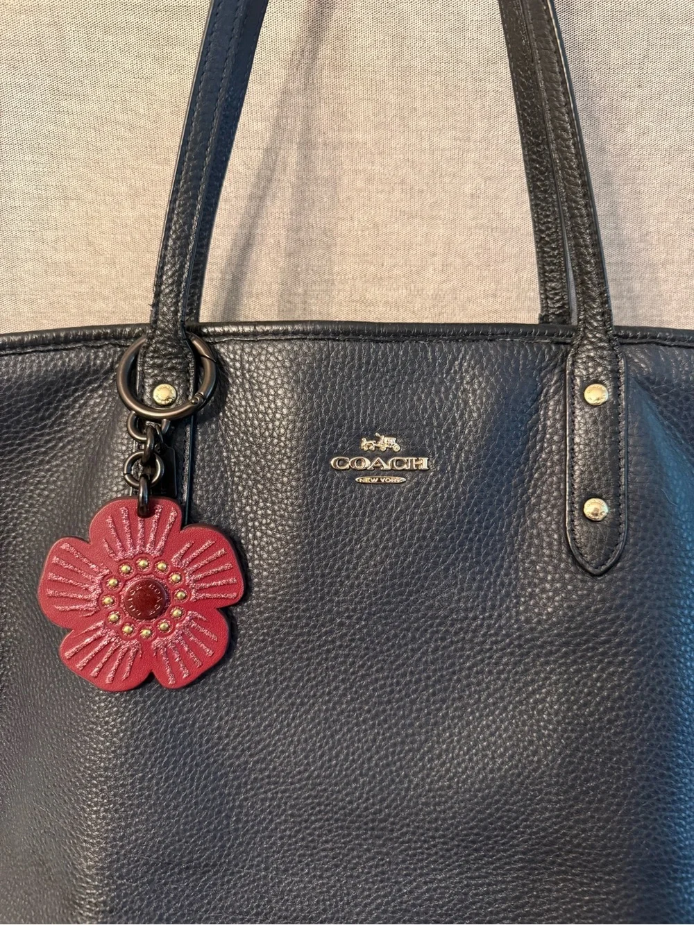 Coach Black Pebbled Leather Tote with Red Flower Charm